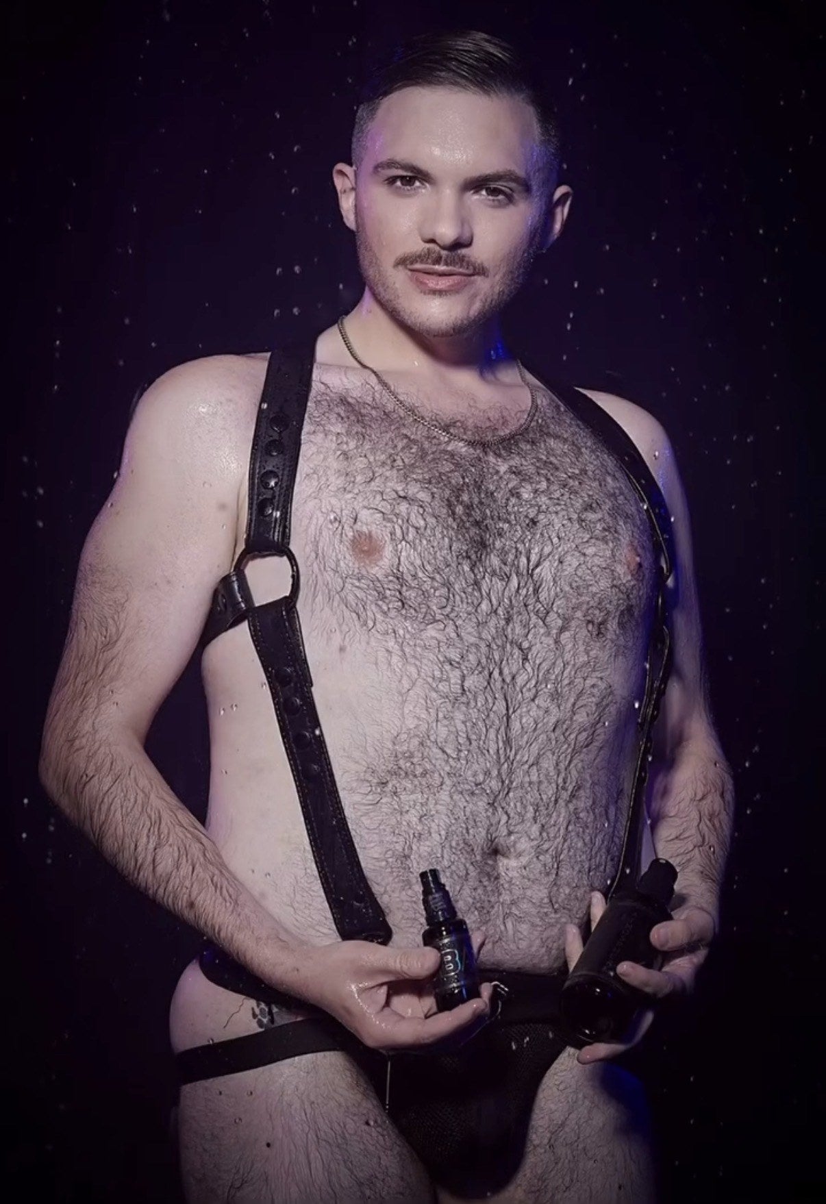 VERSATILE worn under a leather harness, with the lube holster loaded
